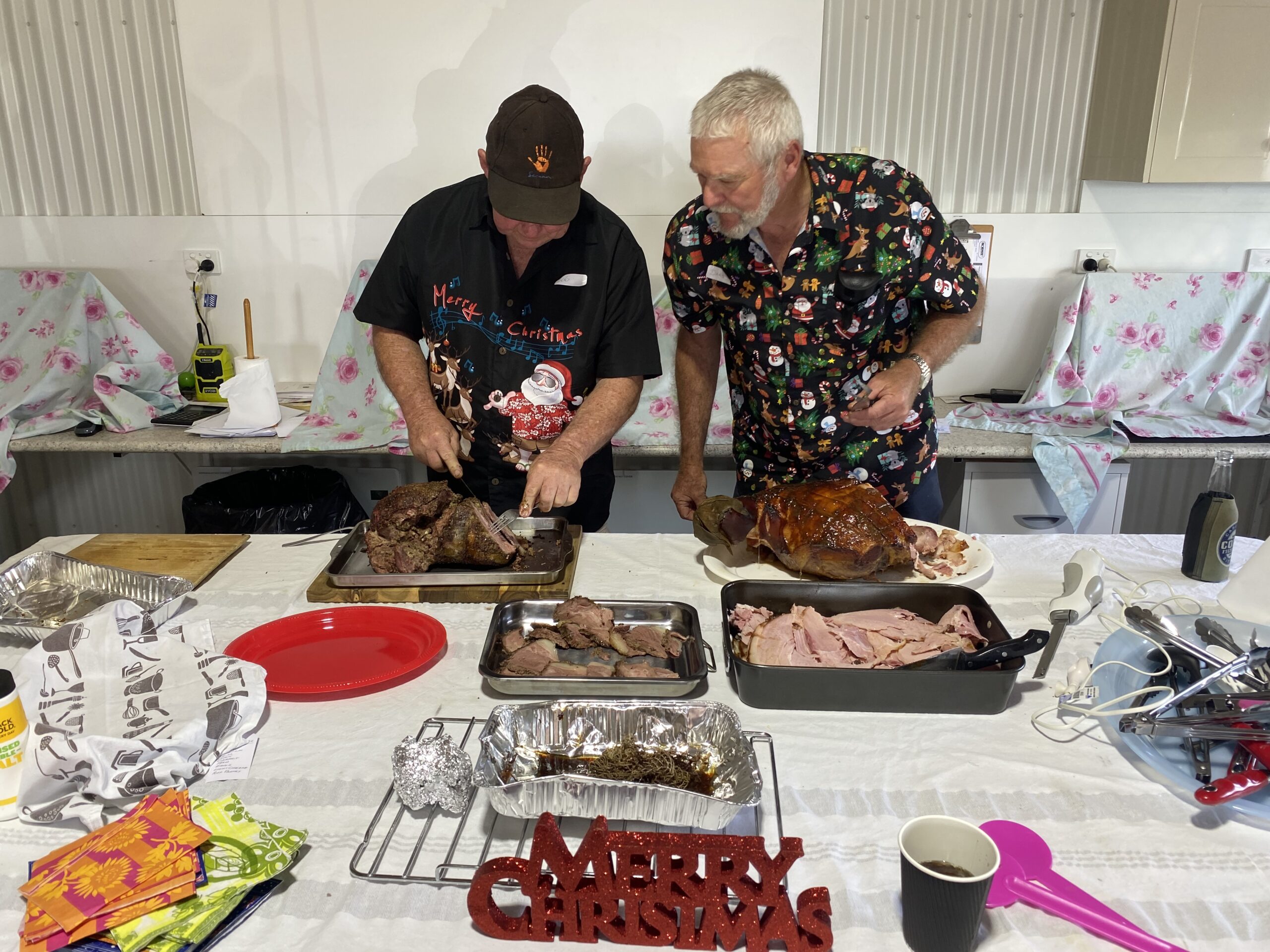 End of year xmas party Bob and Daryl serving the meat